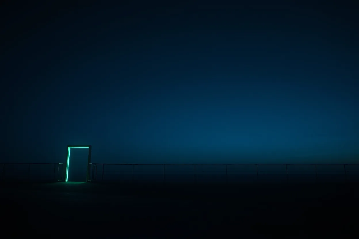 A vast night sky over a dark horizon line of railing, a single doorway at the left edge glowing teal against the darkness.
